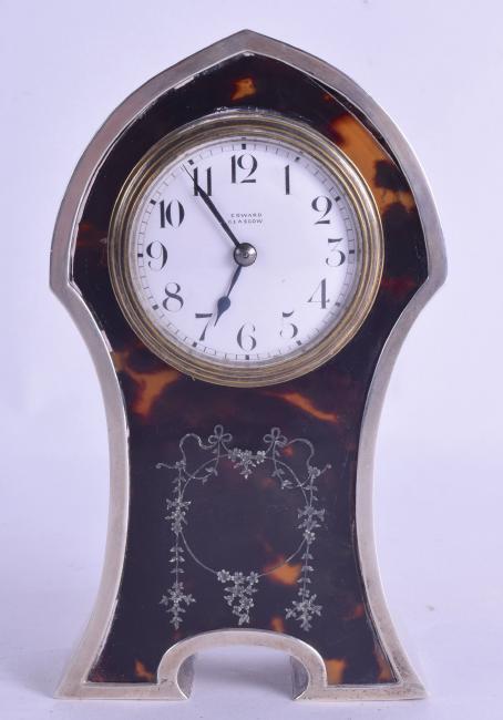 AN ART NOUVEAU SILVER AND TORTOISESHELL MANTEL CLOCK