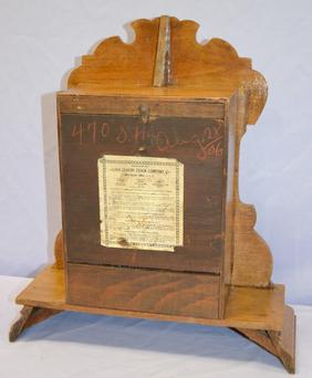 Waterbury Oak “Zambo” Shelf Clock. T&S, signed paper