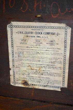 Waterbury Oak “Zambo” Shelf Clock. T&S, signed paper