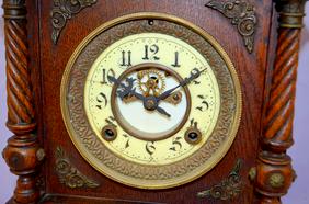 Ornate Wood & Metal Cabinet Clock. T&S, porcelain dial