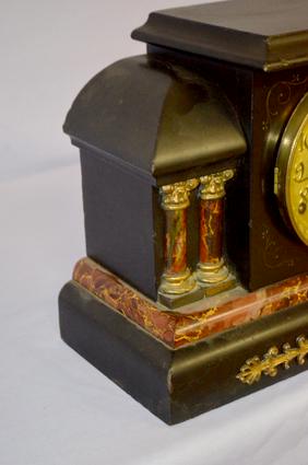 Ermine Mantel Clock. Brown marbleized moldings and