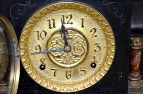 Ermine Mantel Clock. Brown marbleized moldings and
