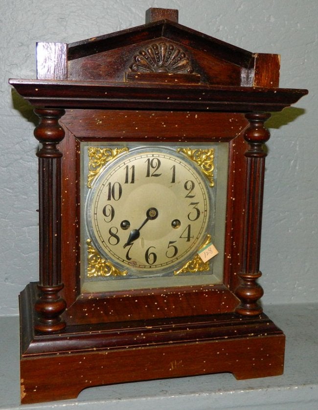 German 8 day German clock w/brass corners.