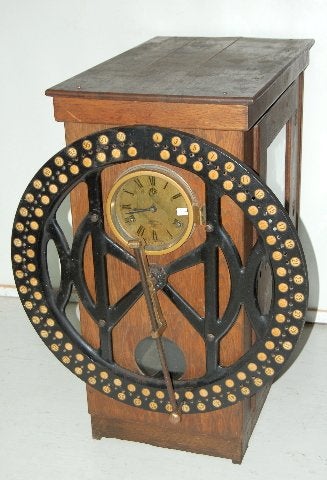 “The Day Time Register” Clock