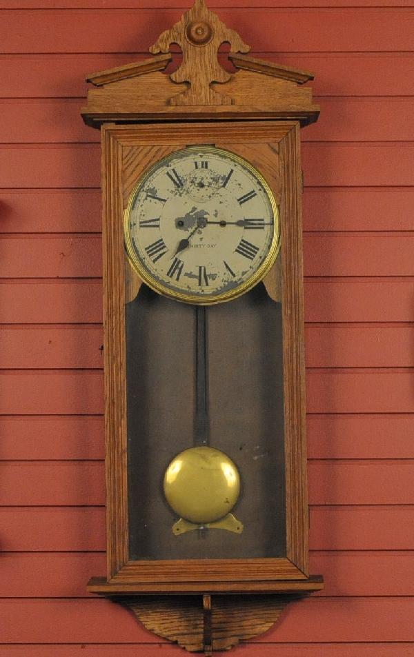 A NEW HAVEN ‘VAMOOSE’ MODEL OAK WALL CLOCK