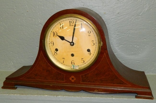 8 day bleach mahogany clock w/ floral inlay.