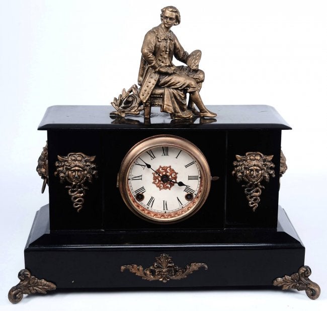 AN ANSONIA ‘BATH’ ENAMELED IRON MANTEL CLOCK