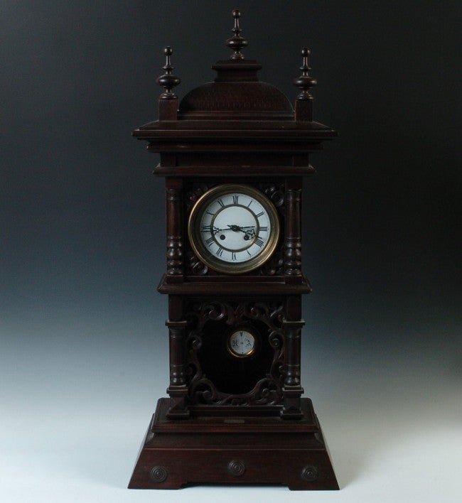 A TALL GERMAN R-A PENDULUM CABINET CLOCK