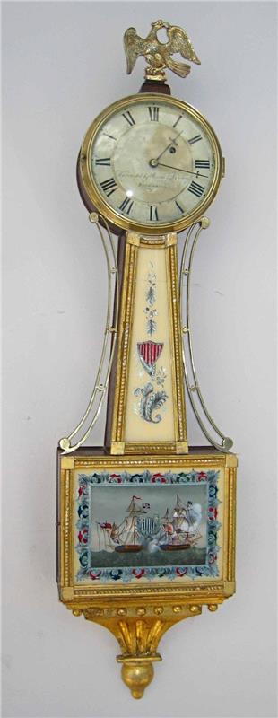Gilt front banjo clock by Curtis & Dunning