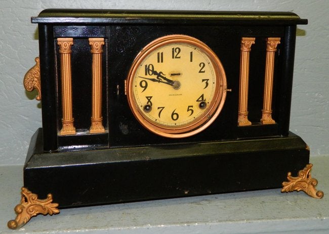 Ingraham black and gold decorated shelf clock.