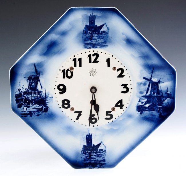 A JUNGHANS BLUE AND WHITE DELFT-TYPE KITCHEN CLOCK