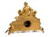 A gilt-bronze and porcelain mantel clock and candelabra