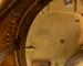 A gilt-bronze and porcelain mantel clock and candelabra