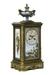 A French gilt-bronze and porcelain mantel clock