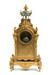 A gilt-bronze and porcelain mantel clock and garniture