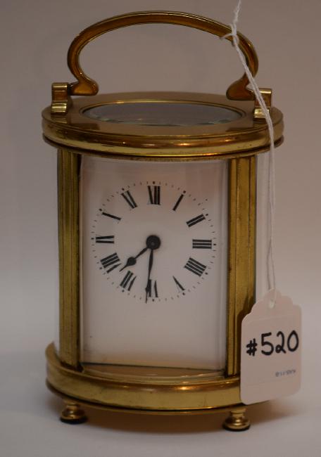 French Oval Carriage Clock with swing handle.  The