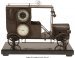 A Car-Form Clock, Barometer on Plinth 12-3/4 x 1