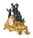 A French Gilt and Patinated Bronze Figural Mantel Clock