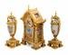 A French Gilt Bronze and Painted Porcelain Clock