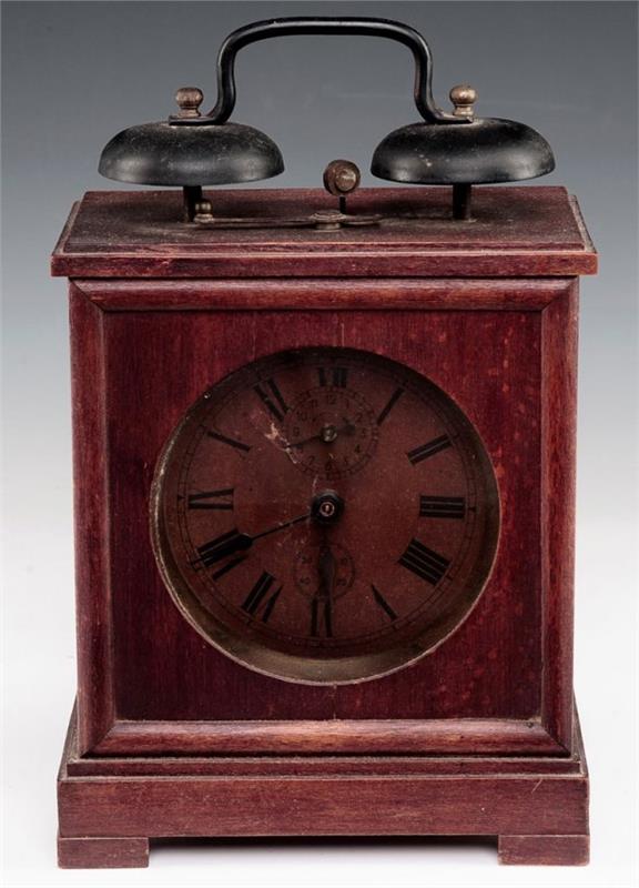 A WOOD CASE ALARM CLOCK WITH DOUBLE BRASS BELLS