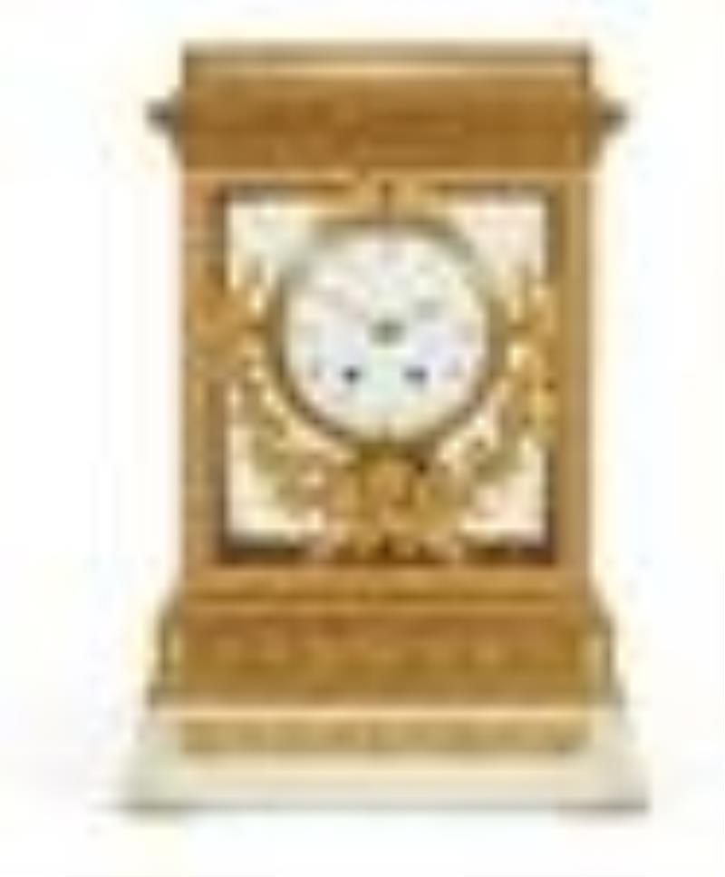 A Louis XVI style bronze & marble mantel clock