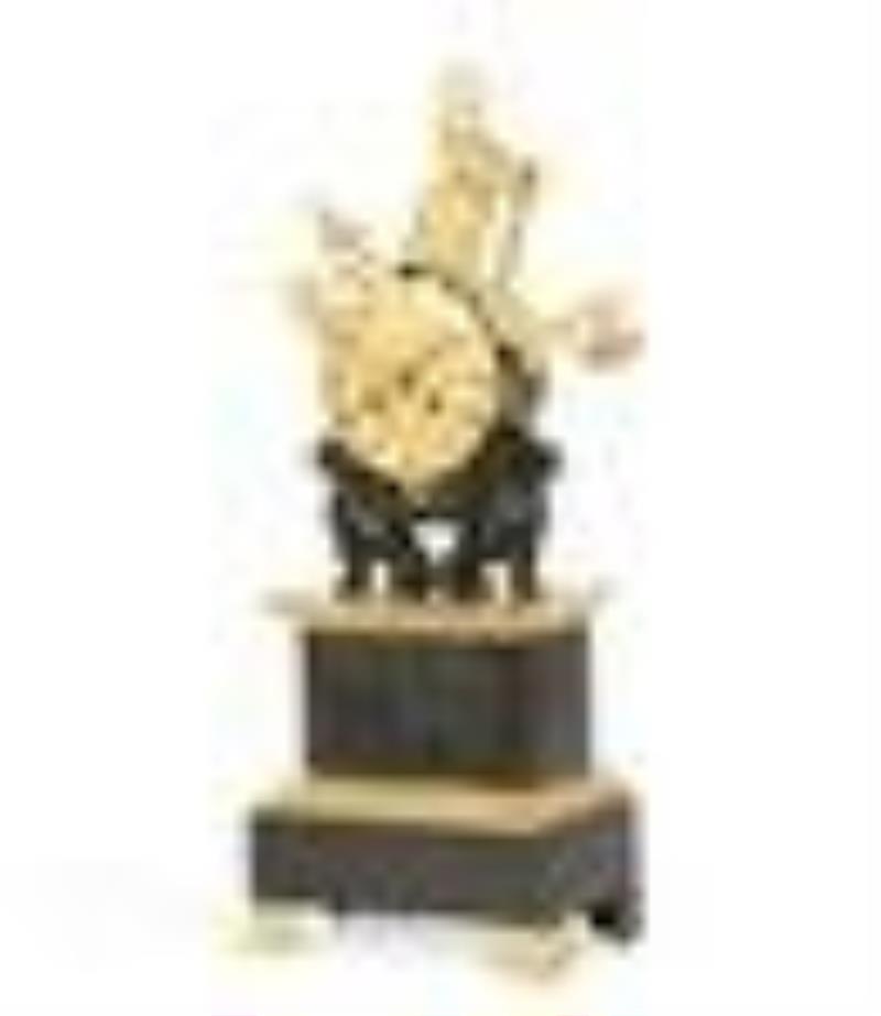 A Charles X bronze military trophy mantel clock