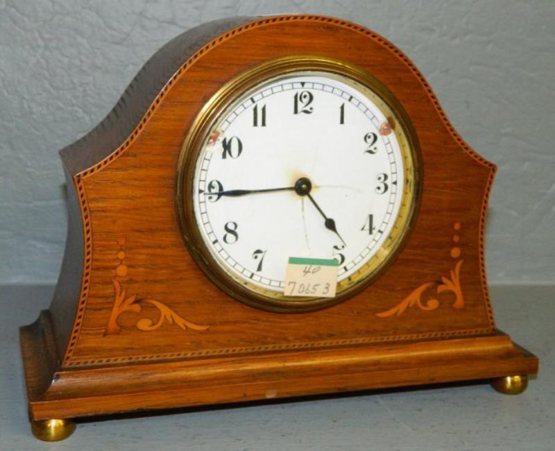 8 day oak shelf clock w/ Swiss movement.