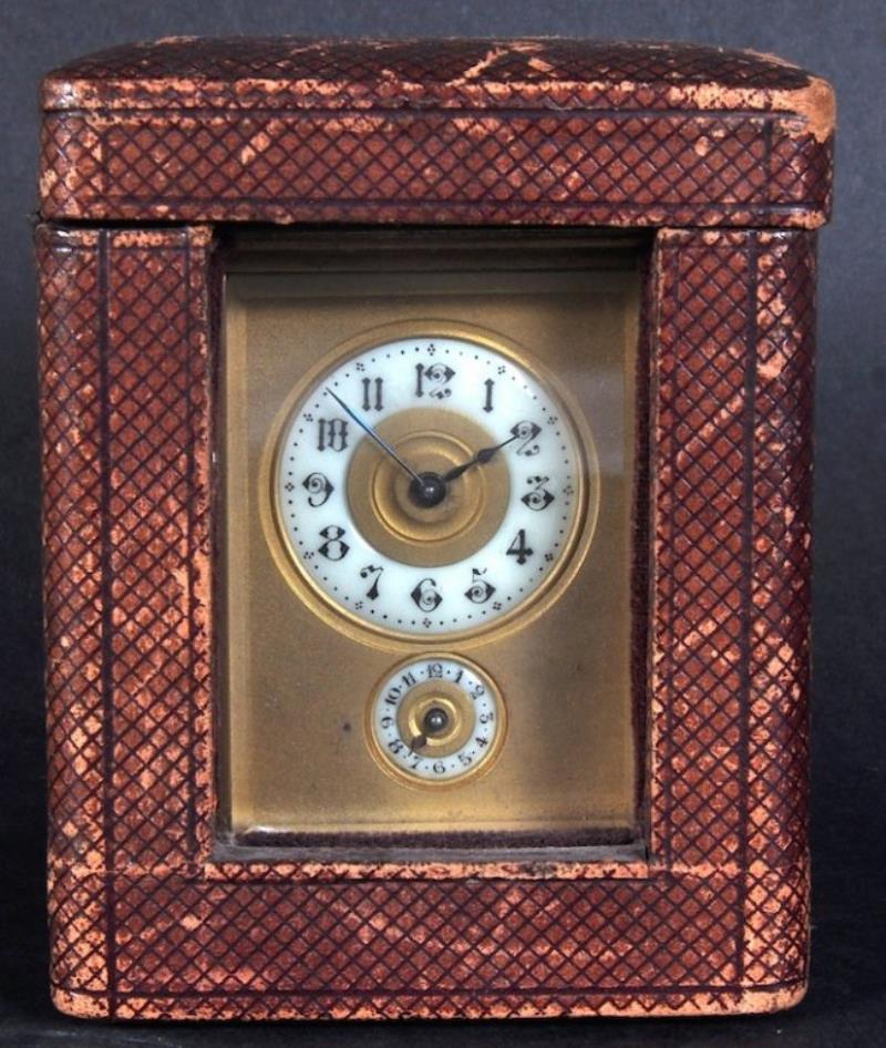 A 19TH CENTURY FRENCH BRASS CARRIAGE CLOCK, with alarm.