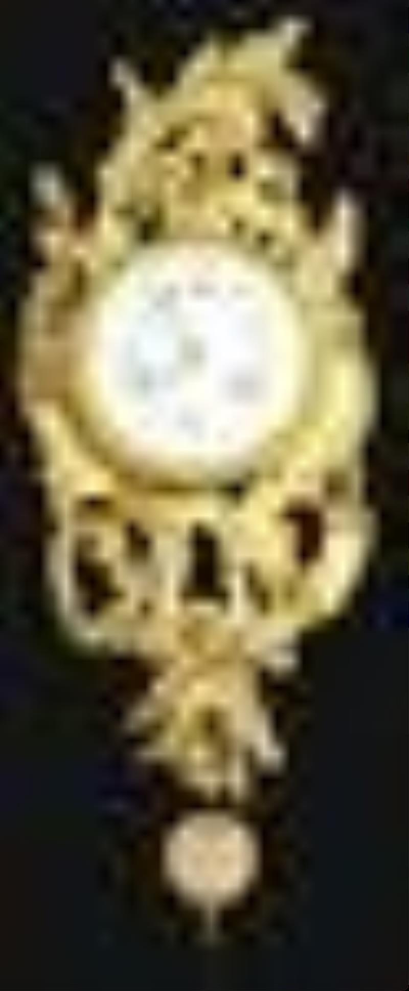 SMALL FRENCH GILT WALL CLOCK.