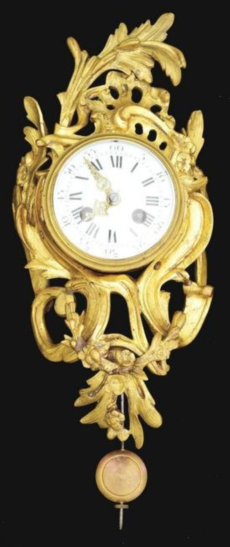 SMALL FRENCH GILT WALL CLOCK.