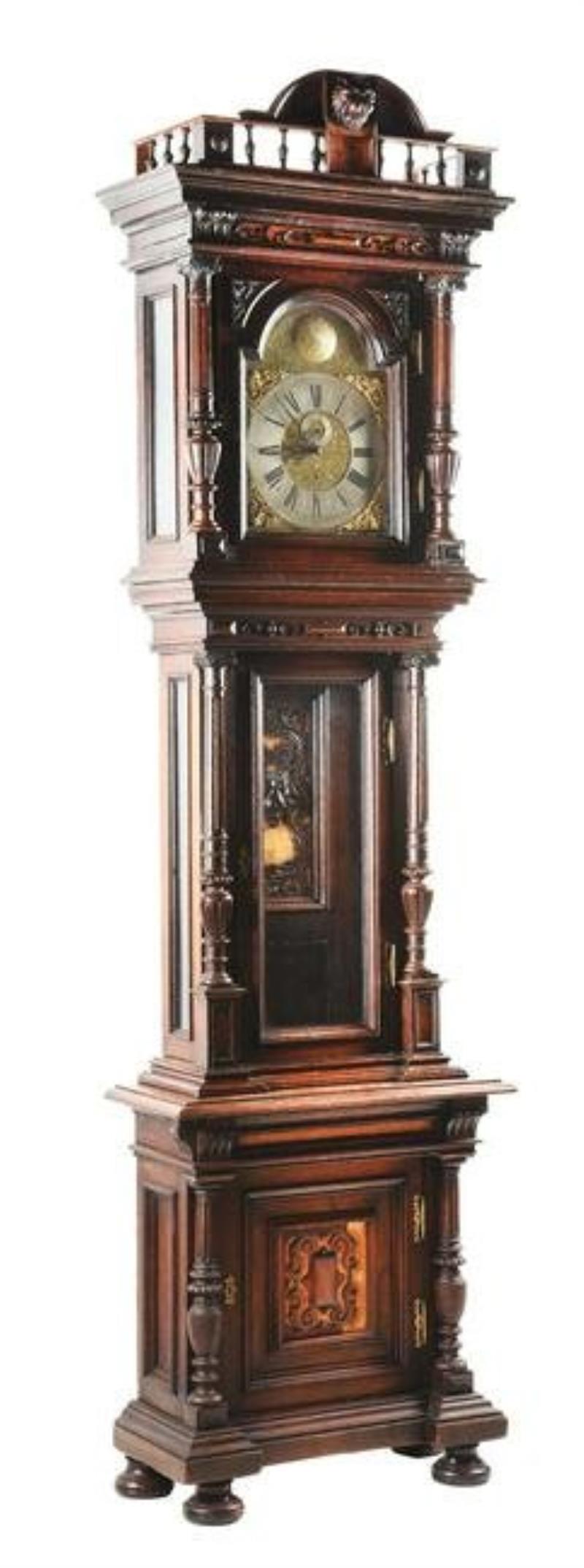 CARVED WALNUT TALL CASE CLOCK IN THE STYLE OF OTTO