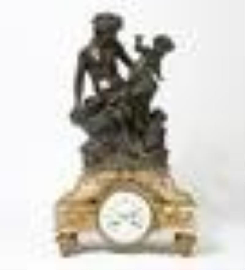 A French bronze & marble clock, after Clodion