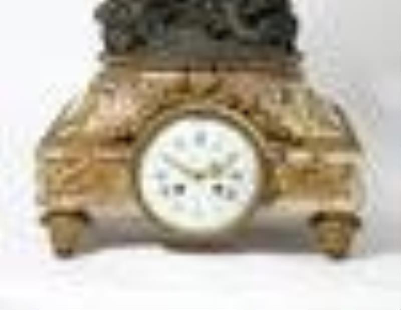 A French bronze & marble clock, after Clodion