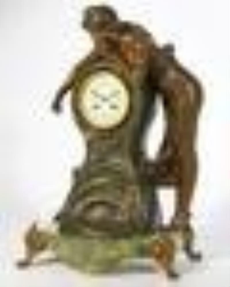 A French figural spelter and onyx mantel clock
