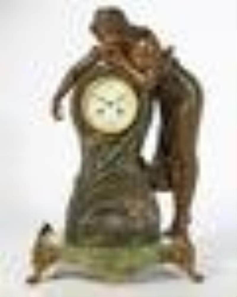 A French figural spelter and onyx mantel clock