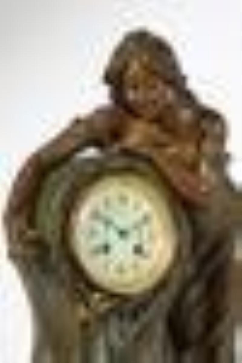 A French figural spelter and onyx mantel clock