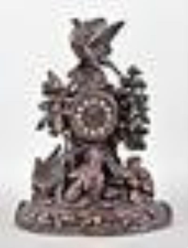 Carved Black Forest mantel clock