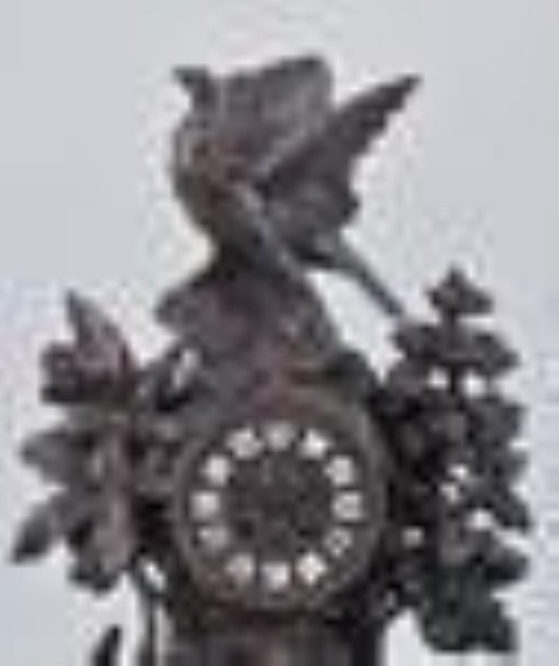 Carved Black Forest mantel clock