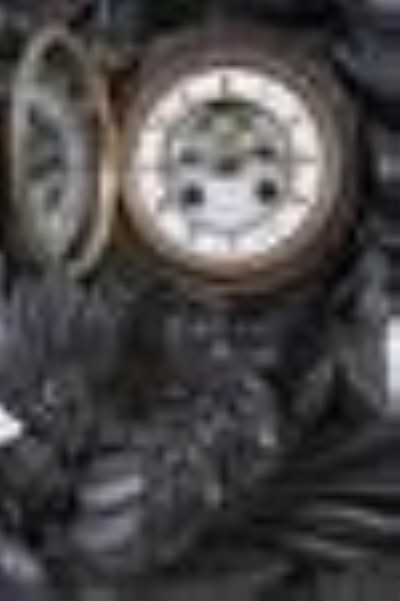 Carved Black Forest mantel clock with a French movement