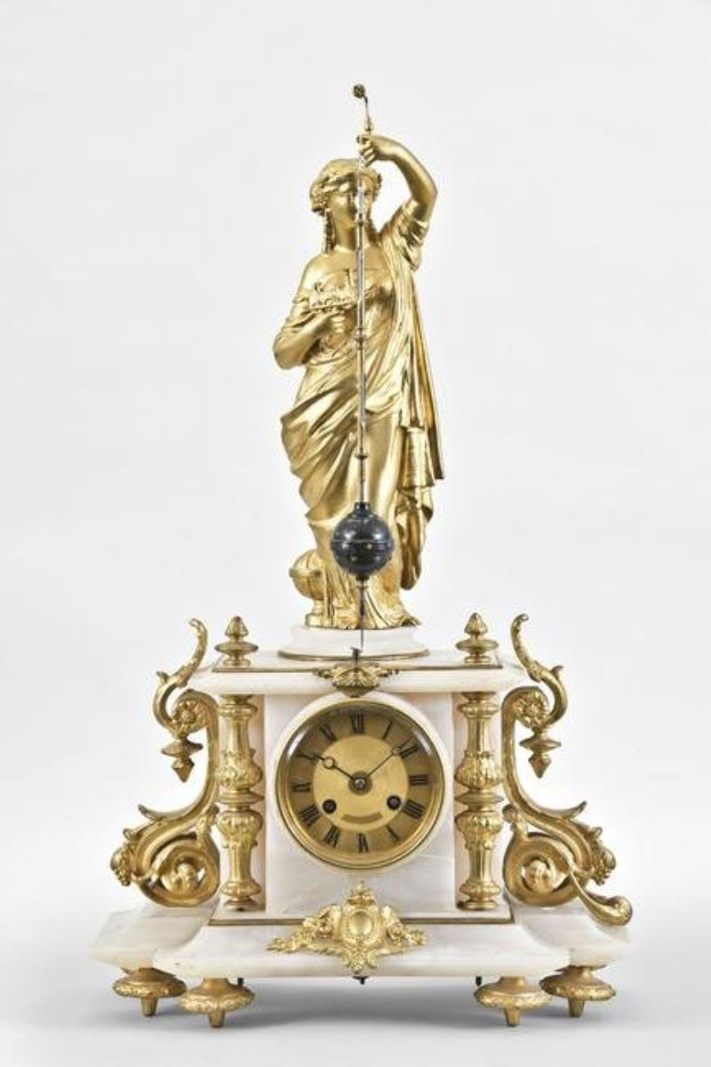 A late 19th century French figural mantel clock with