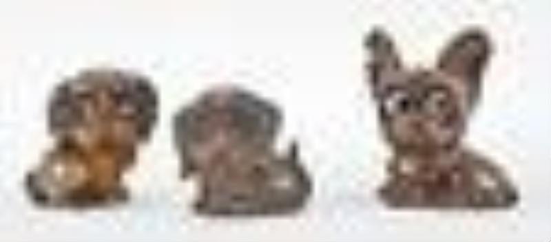 Three Oswald rotating eye dogs novelty clocks.