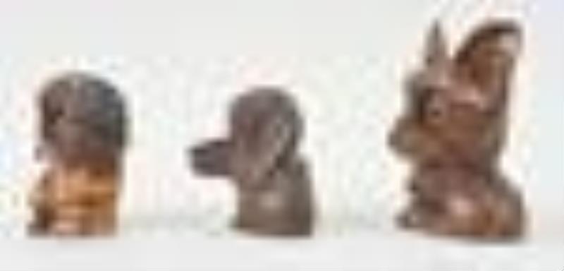 Three Oswald rotating eye dogs novelty clocks.