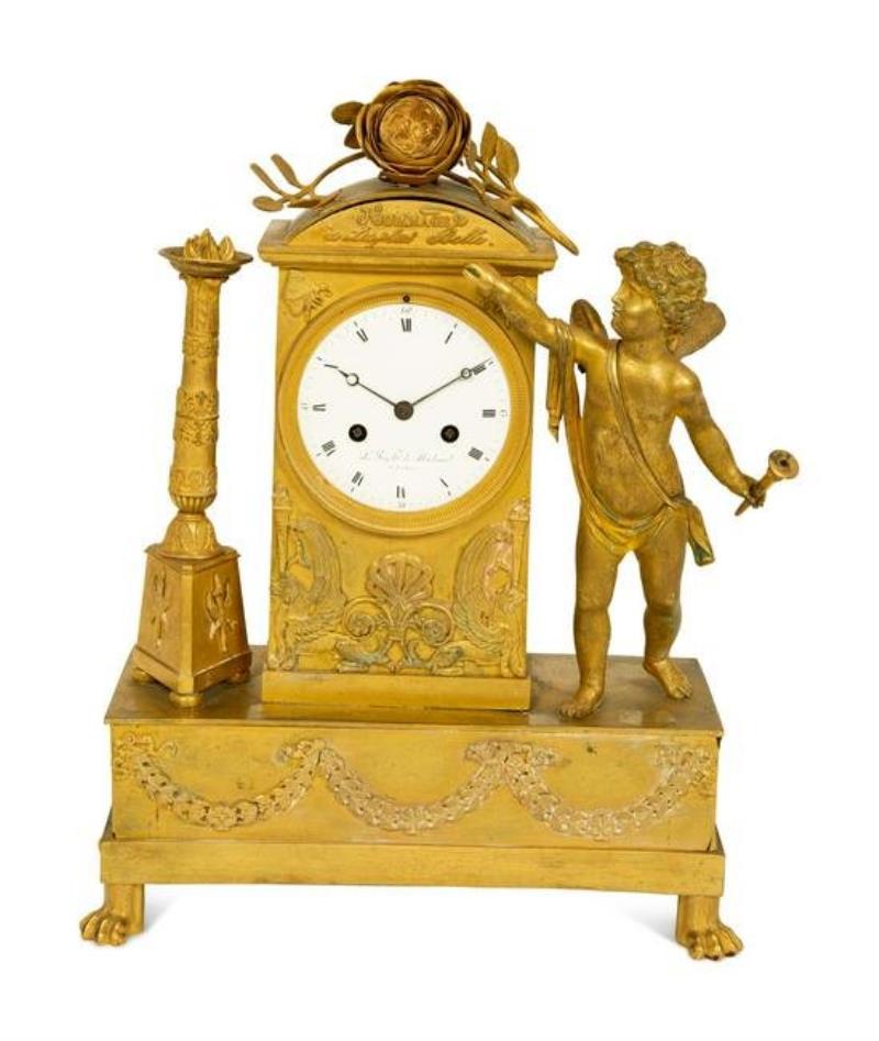 A French Empire Gilt Bronze Mantle Clock Homage a La