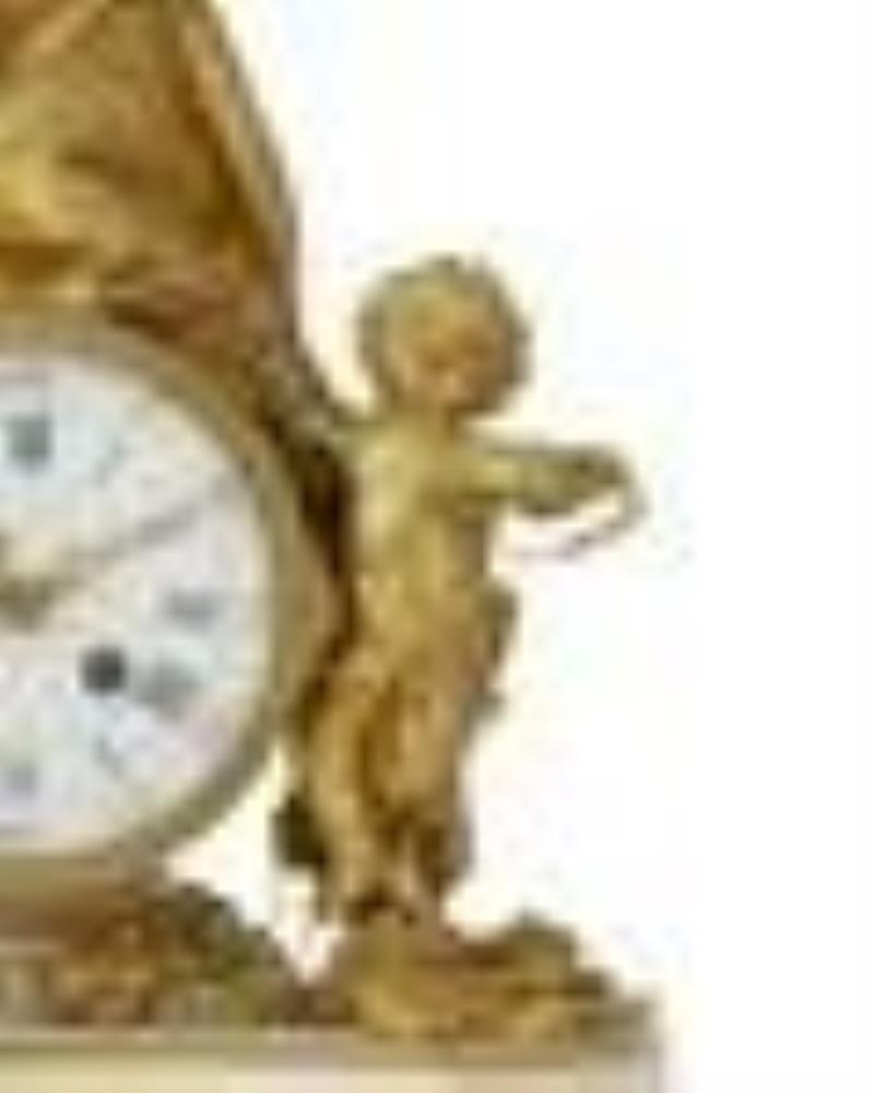 A French figural gilt-bronze table clock