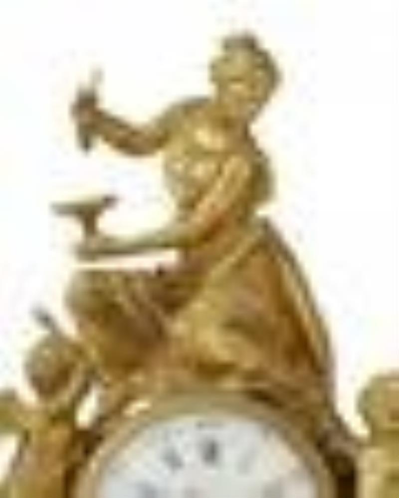 A French figural gilt-bronze table clock