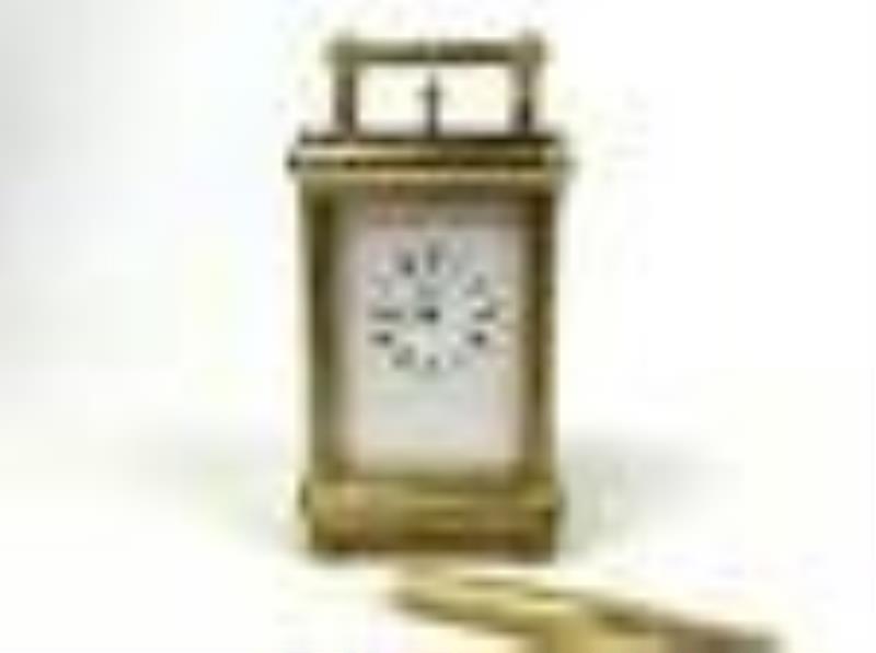A Marcus & Co. Gilt 5 Minute Repeater Carriage Clock