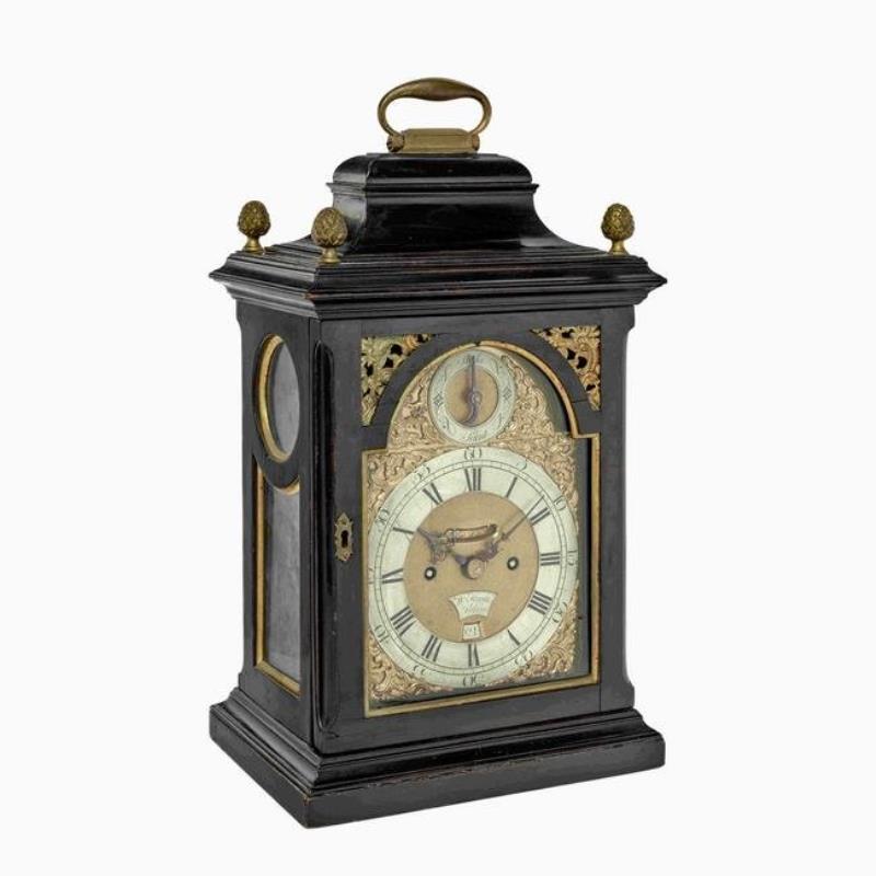 A late 18th century EBONIZED STRIKING TABLE CLOCK WITH