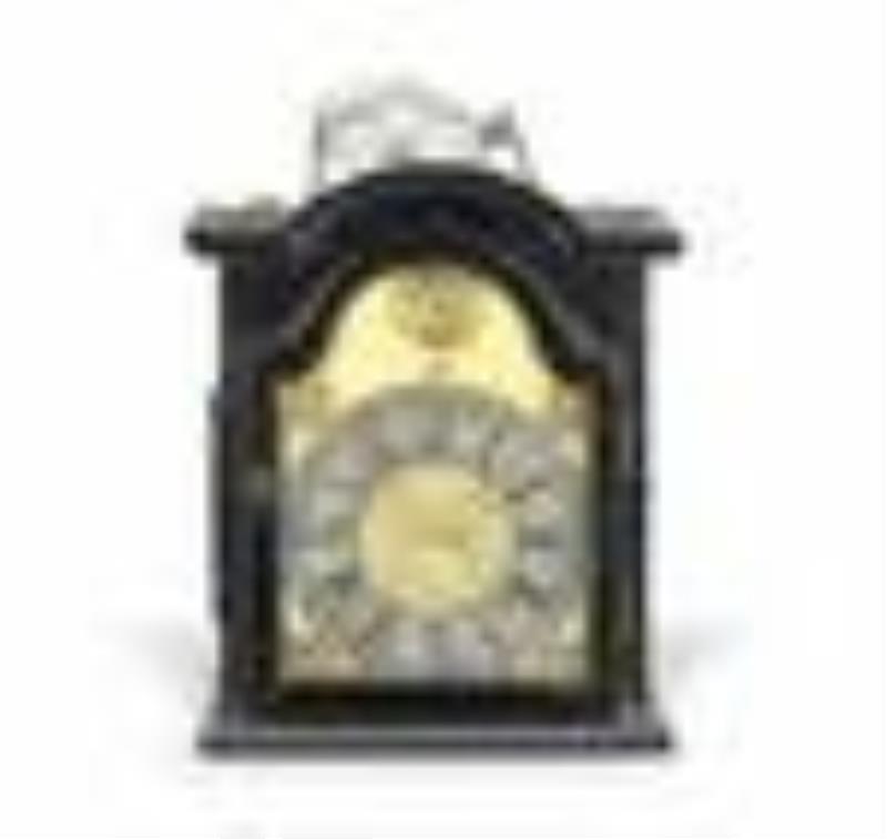 A 19th century European weight driven wall clock with
