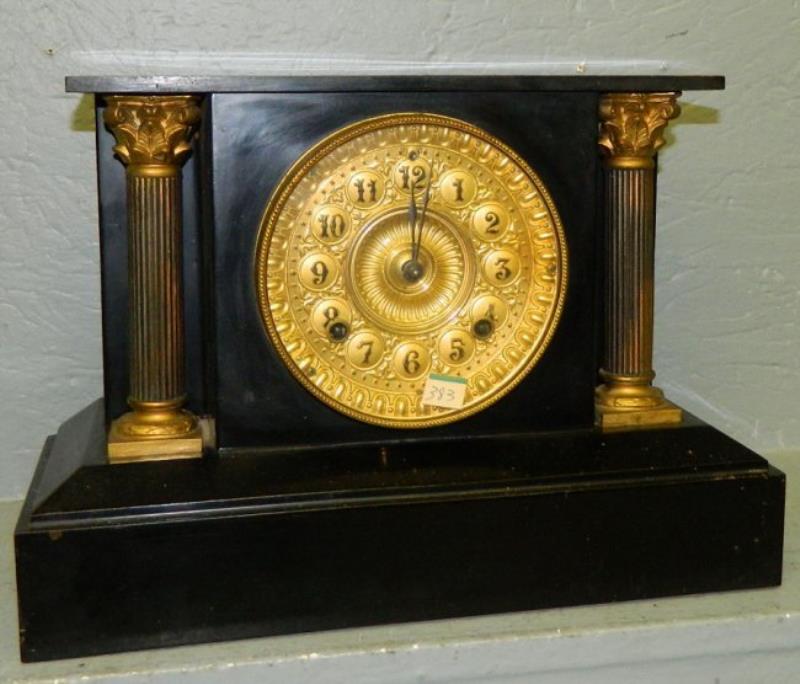 Ansonia 8 day clock with brass columns.