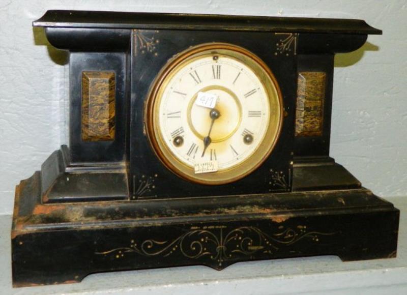 Waterbury 8 day  gold etched mantel clock.